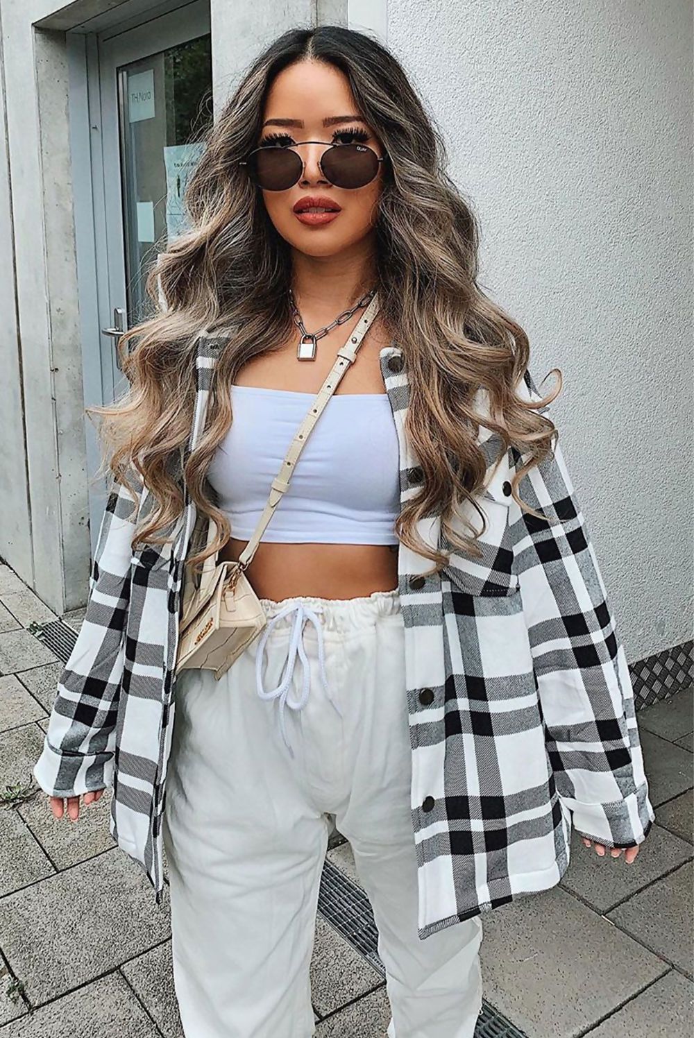 Black and white check shacket for women by Azure Theseus, showcasing a stylish casual outerwear piece with button closure.