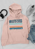 Jade Thalassa Blessed hoodie featuring a peach design, casual comfort, and soft fabric, worn by a person in a relaxed setting.