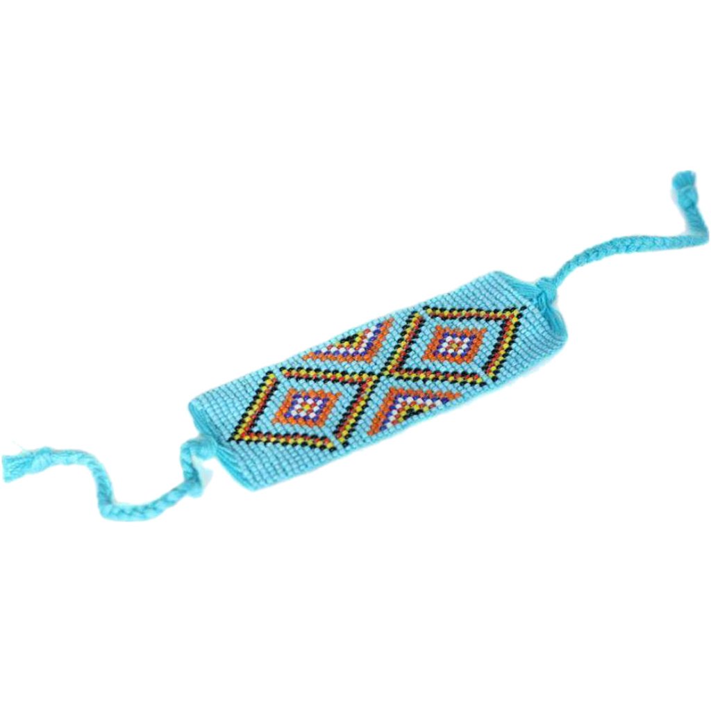 Blue geometric beaded cuff bracelet by Ariel, featuring intricate bead patterns and a stylish design for elegant wristwear.