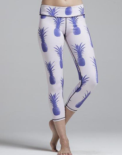 Blue Pineapple Legging from Sky Felix, featuring vibrant pineapple print, shown laid flat with smooth, stretchy fabric.