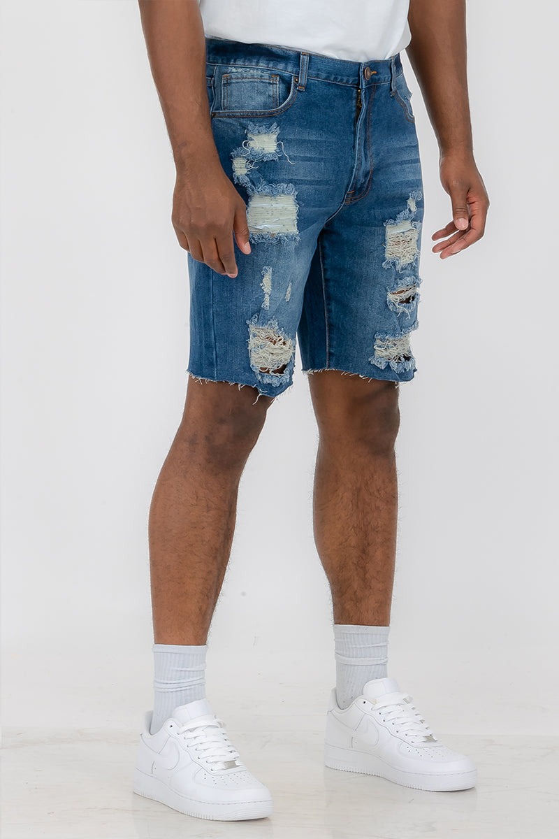 Blue washed distressed denim shorts for men by Lime Milo, featuring frayed edges and casual style.