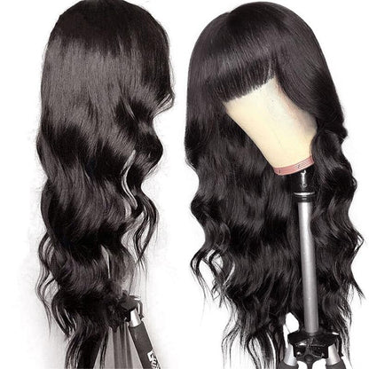 Cerise Alfie body wave Brazilian human hair wig with bangs, full machine-made wig displaying natural waves and layered bangs.