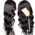 Cerise Alfie body wave Brazilian human hair wig with bangs, full machine-made wig displaying natural waves and layered bangs.