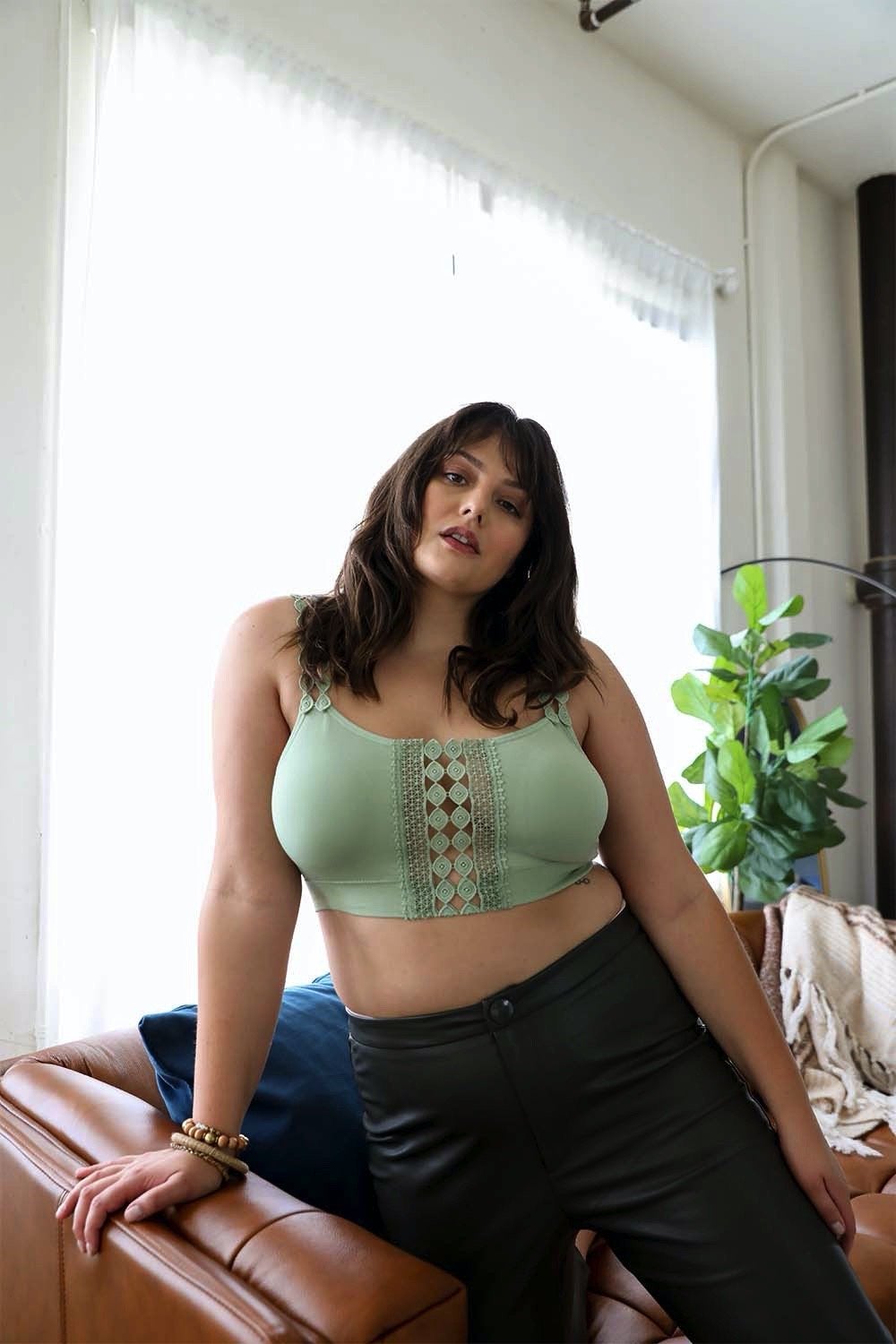 Periwinkle Aether Eye Lace Applique Bralette featuring intricate lace details and boho-inspired design, shown on a flat surface.