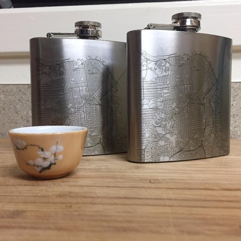 Cyan Castor Boyne Mountain Resort Michigan engraved topographic map hip flask, metal container with detailed mountain design.