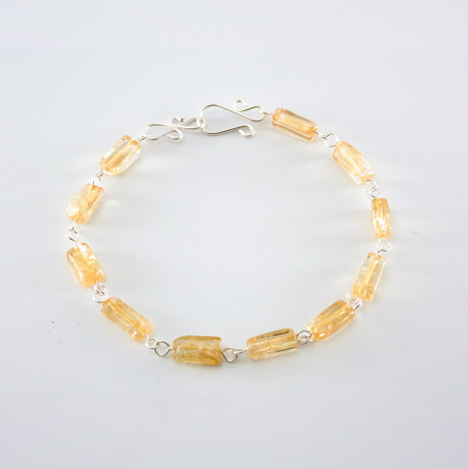 Silver Citrine rectangular link bracelet from Grey Clymene with polished citrine stones and silver chain links.