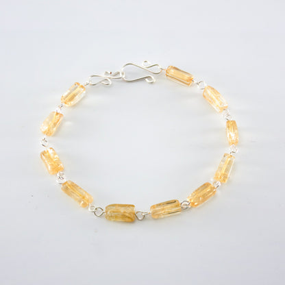 Silver Citrine rectangular link bracelet from Grey Clymene with polished citrine stones and silver chain links.