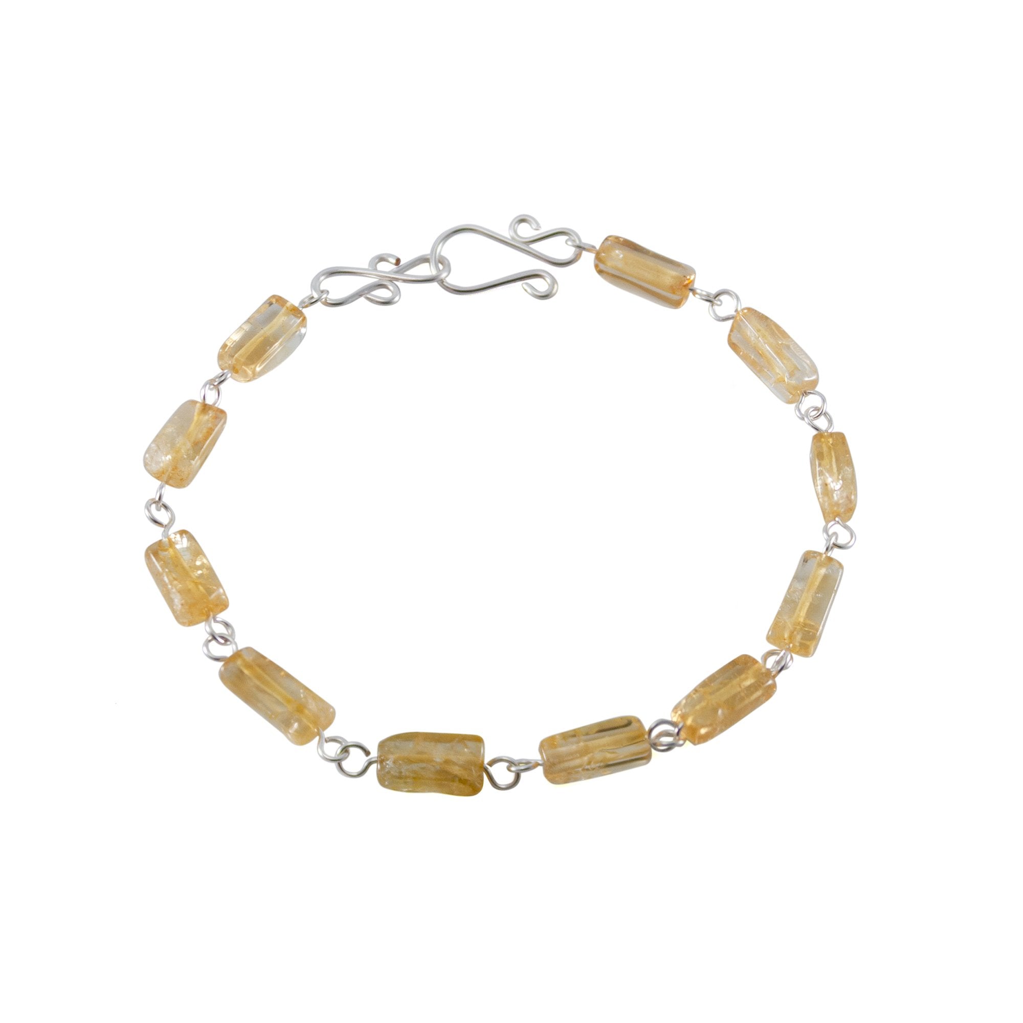 Silver rectangular link bracelet featuring citrine stones, crafted by Grey Clymene, showcasing elegant jewelry design.