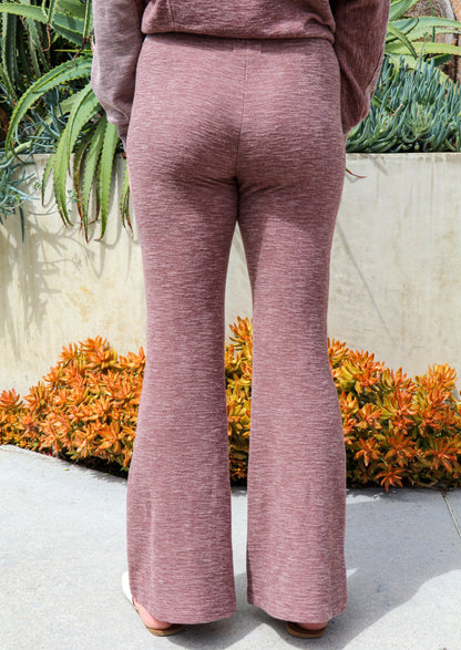 Taupe Morgan Flared Pants by Brown Tartarus featuring ribbed fabric and a relaxed, comfortable fit suitable for yoga and casual wear.