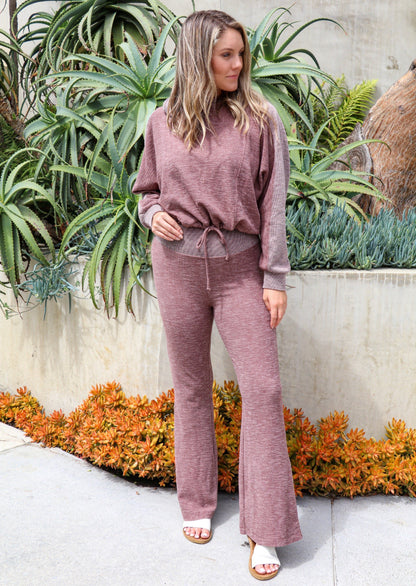 Brown Tartarus Morgan Flared Pants in taupe, featuring a ribbed fabric and relaxed fit, shown with a hoodie and sweatshirt.