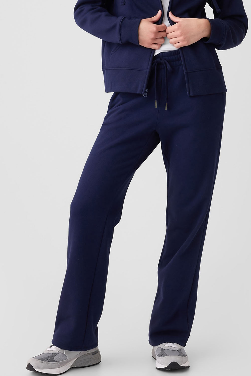 Navy blue fleece-lined casual pants with drawstring waist by Carmine Juneberry, shown on a model.