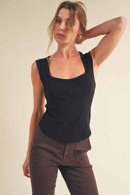 Jade Icarus Aemi + Co exposed seam ribbed wide strap tank top for women, featuring a fitted ribbed design and wide straps.