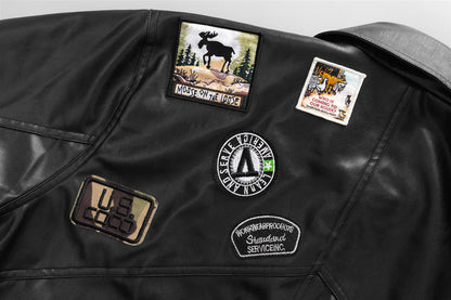 Black Drive Moto Jacket from Carmine Juneberry Haute Edition 25, featuring a sleek leather design and silver hardware.