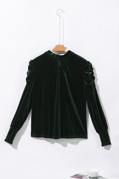 Blackish green velvet puff sleeve mock neck blouse by Carmine Juneberry, featuring a stylish design and elegant fabric details.