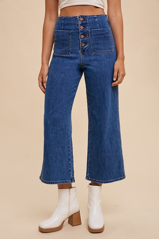 High waist Annie Wear button fly jeans by Jade Icarus, featuring classic denim with visible stitching and a high-rise fit.