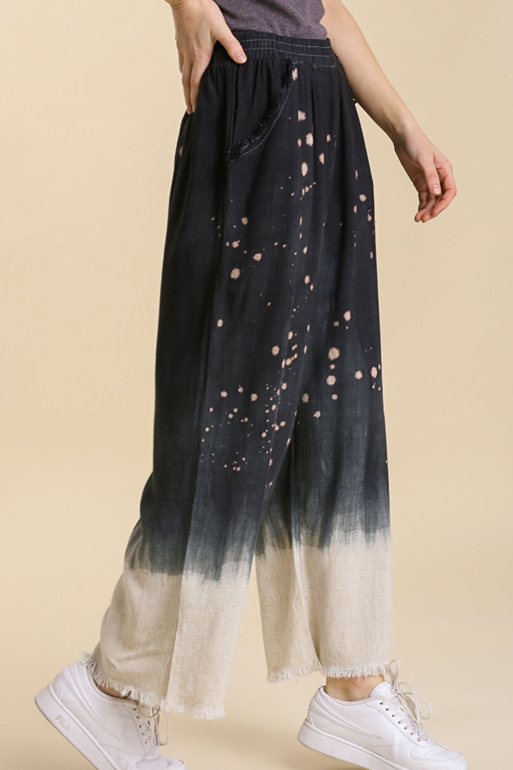Jade Icarus Umgee linen blend wide-leg pants with raw hem and bleach dip dye, displayed on a mannequin.