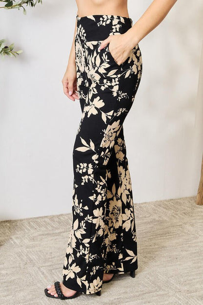Jade Icarus Heidi Flare Pants in denim with high waist and wide-leg style, shown on a model against a neutral background.
