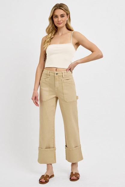 Automotive patch jeans by Jade Icarus featuring high-rise, wide-leg, straight cuffed style in plus size, shown on a model.