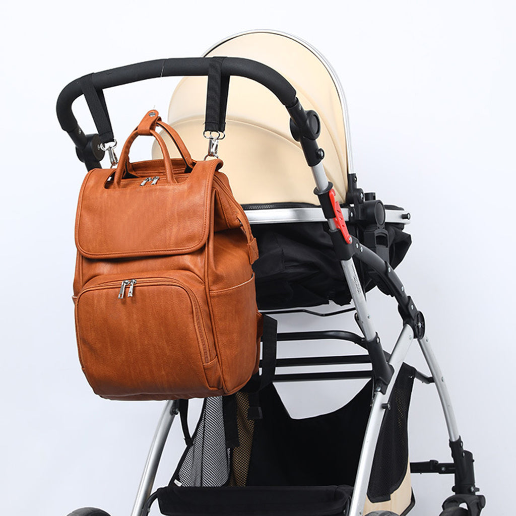 Maroon Asteria PU leather diaper bag with multiple compartments, designed for moms and baby essentials, in a stylish maternity bag.