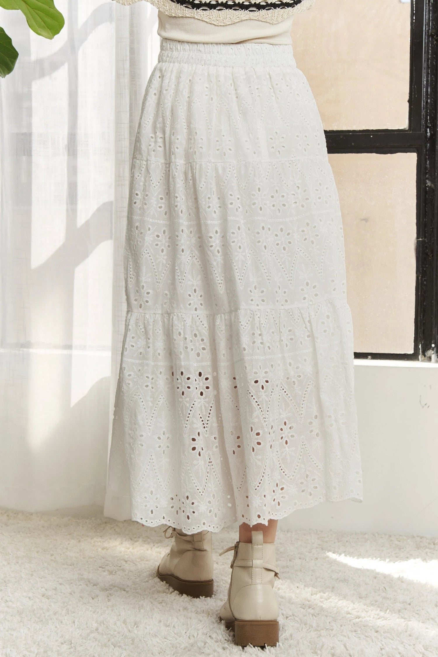 Jade Icarus ADORA elastic waistband tiered midi skirt in fabric, shown in a stylish automotive-inspired design.