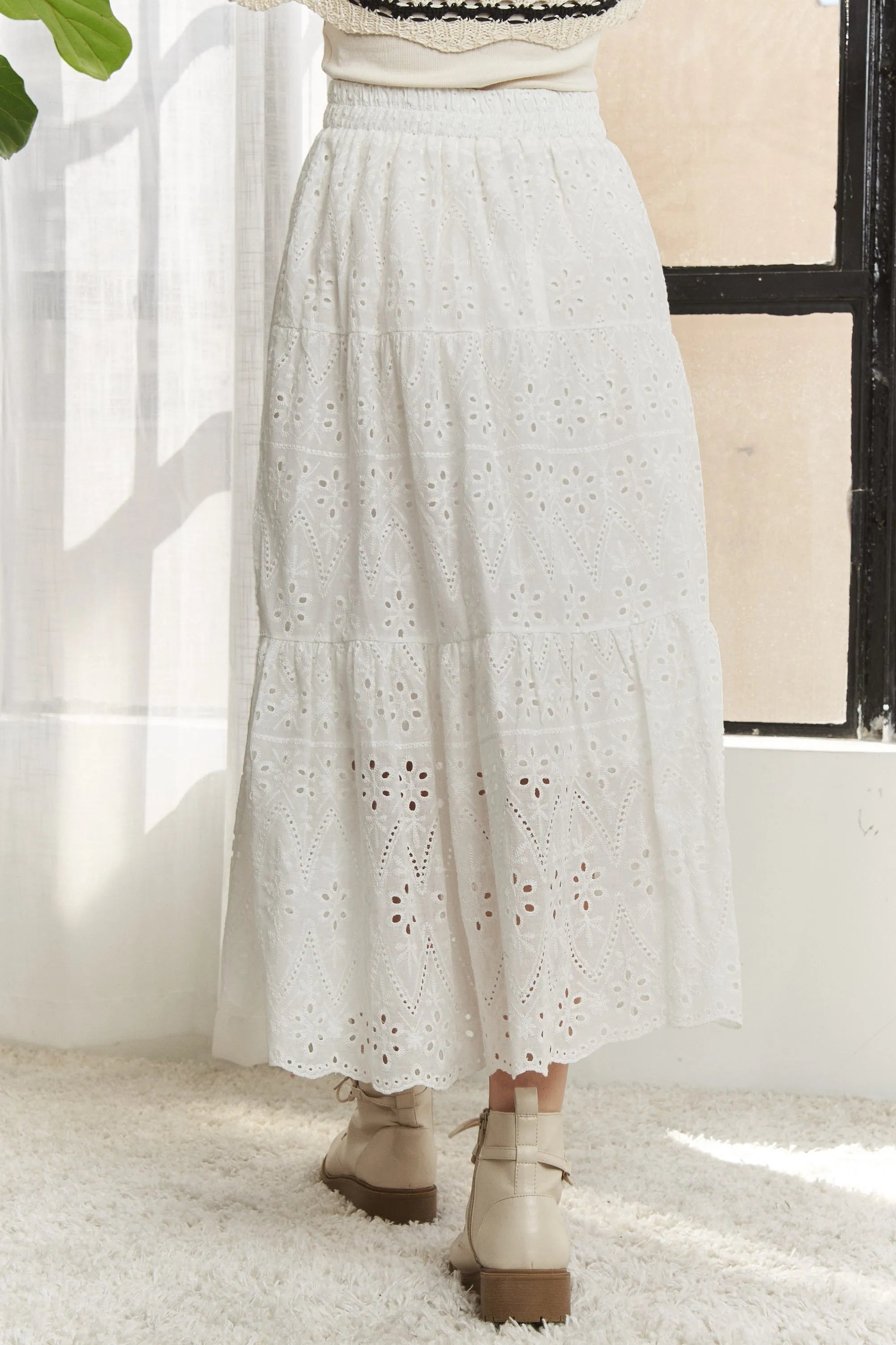 Jade Icarus ADORA elastic waistband tiered midi skirt in fabric, shown in a stylish automotive-inspired design.