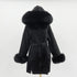 Carmine Juneberry oversized wool coat with double-sided fabric, hood, and plush fur collar, designed for luxurious warmth and style.