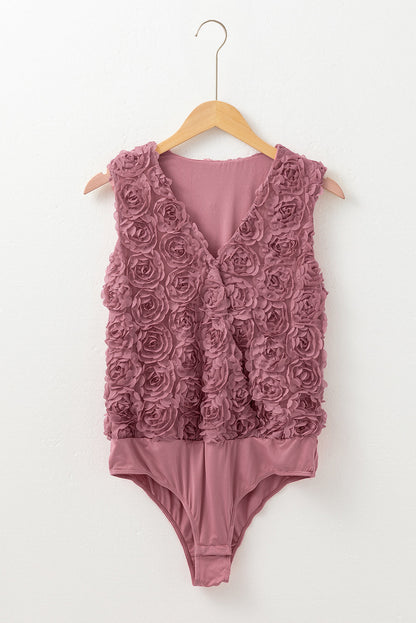 Floral textured v-neck sleeveless bodysuit by Byzantium Bay, wrapped style with fitted silhouette and vibrant floral pattern.
