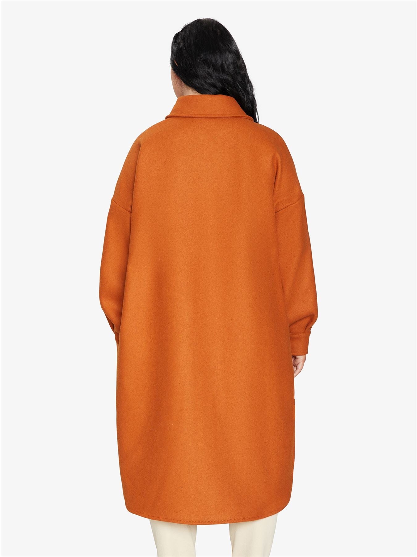 Rose Eleusis oversized longline shacket with a relaxed fit, featuring a button-up design and soft fabric for casual layering.