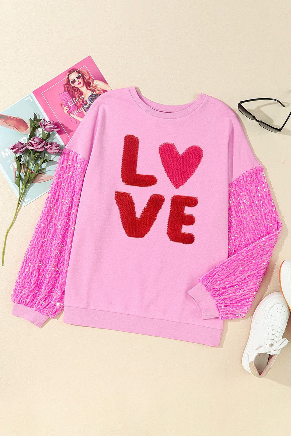 Pink Valentines LOVE chenille embroidered sequin sleeve sweatshirt by Harlequin Daisy, featuring soft fabric and decorative embellishments.