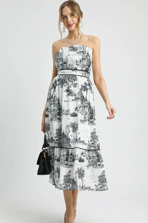 Colorful printed Umgee tiered tube midi dress from Pear Daisy, displayed on a hanger with floral background.