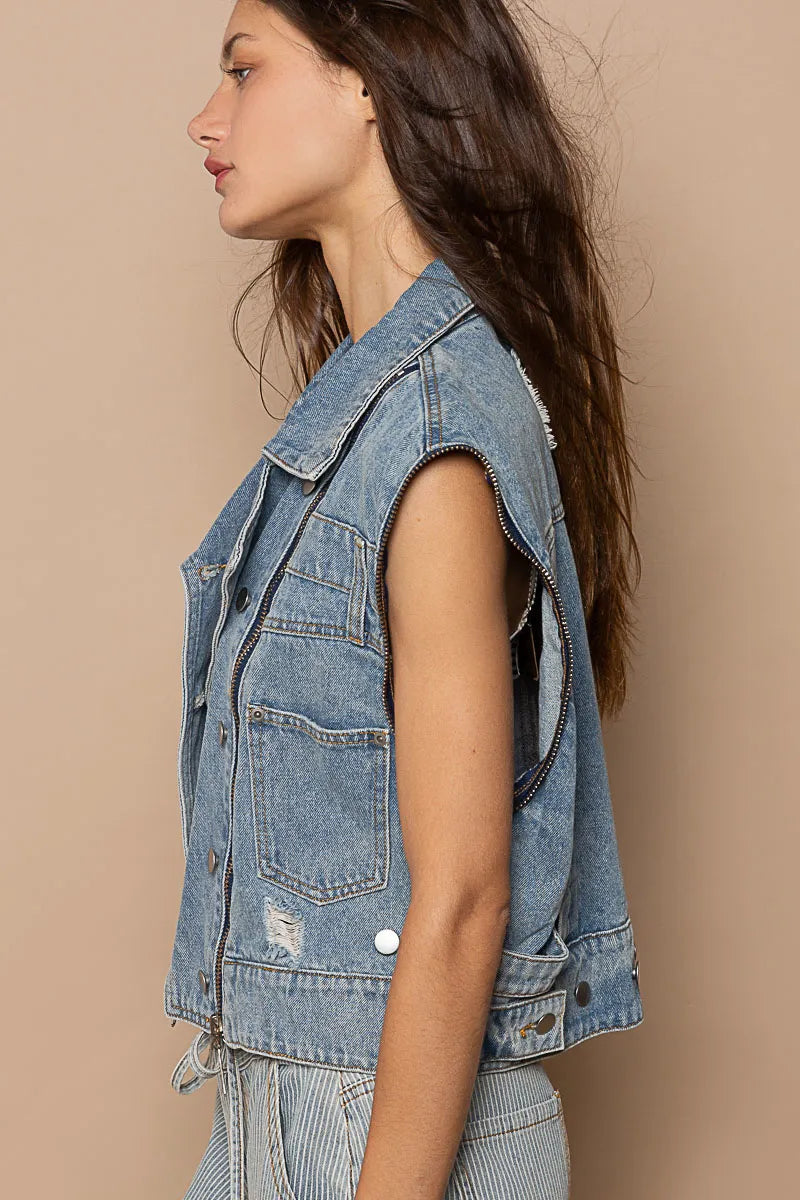 Pear Daisy POL cropped denim jacket with functional zipper detail, showcased on a model in a home and garden setting.