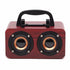 Maroon Asteria wooden wireless Bluetooth speaker for outdoor use, showing the compact portable design and natural wood finish.