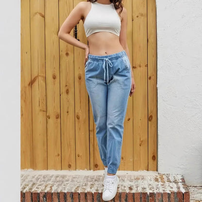 Korean-inspired high waist skinny jeans with elastic waistband by Carmine Juneberry, showcasing a fitted denim design.