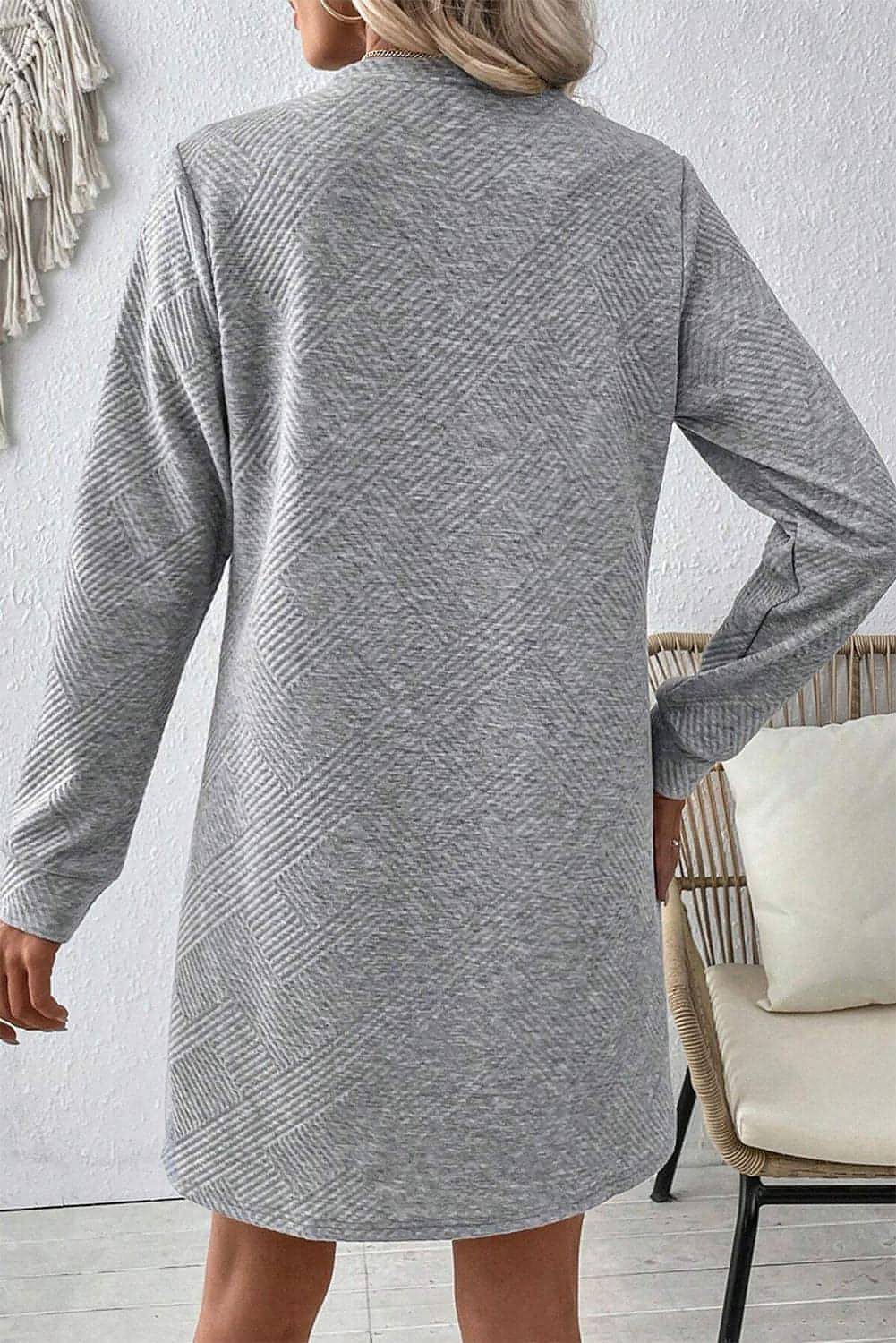 Gray solid color textured long sleeve shift dress by Carmine Juneberry, featuring a relaxed fit and subtle fabric pattern.