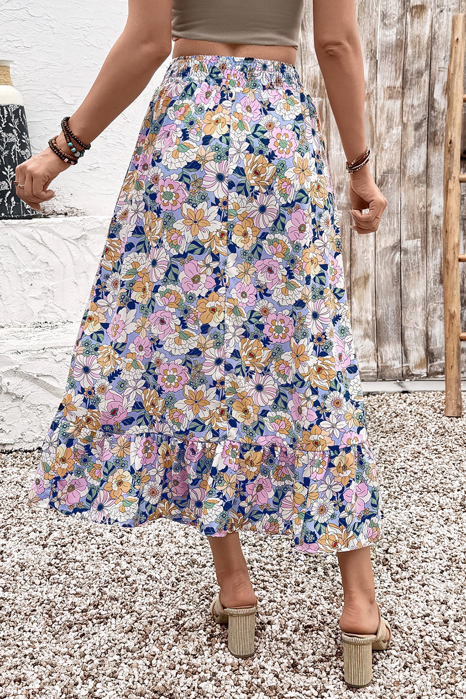 Floral lace-up high waist ruffle maxi skirt for women by Byzantium Bay, featuring a flowing design with floral patterns and ruffled hem.