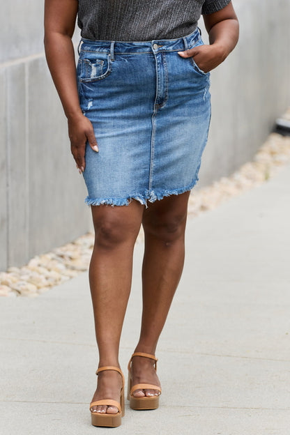 Jade Icarus RISEN Amelia full size denim mini skirt displayed on a mannequin, showcasing classic denim design and fit.