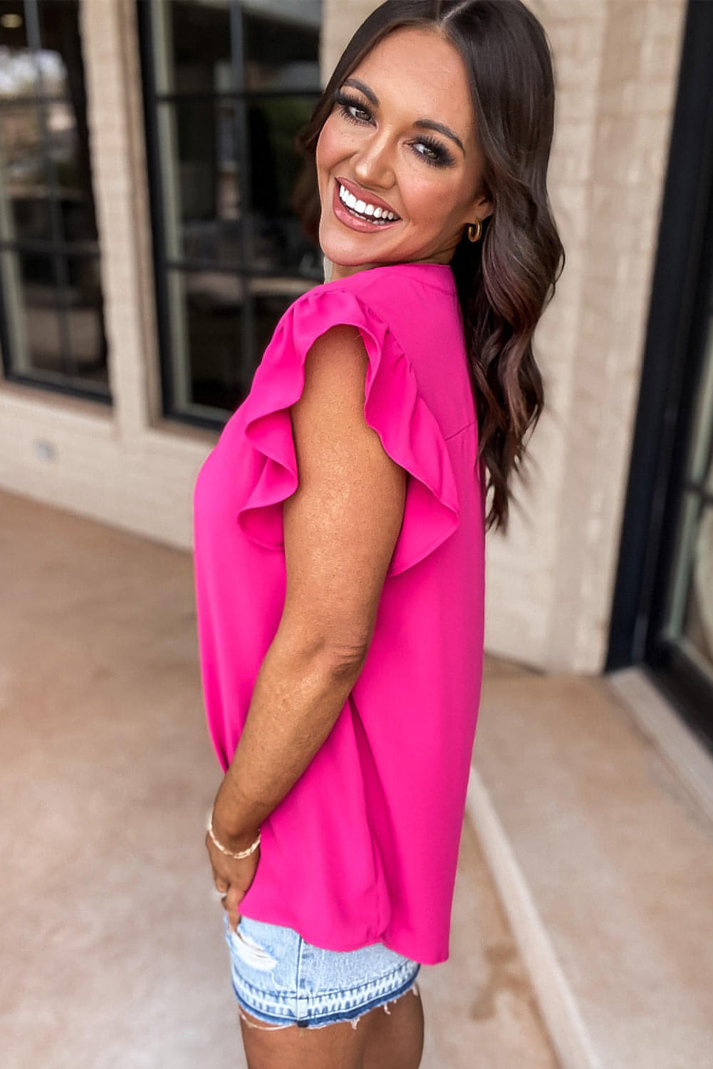 Rose red notched neck ruffle sleeve blouse from Carmine Juneberry, featuring stylish ruffles and a feminine neckline.