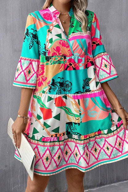 Multicolour abstract printed half sleeve mini dress with notched neck by Carmine Juneberry, featuring vibrant, artistic design.
