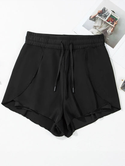 Pear Daisy high waisted drawstring swim shorts with a relaxed fit, suitable for beach or poolside lounging.