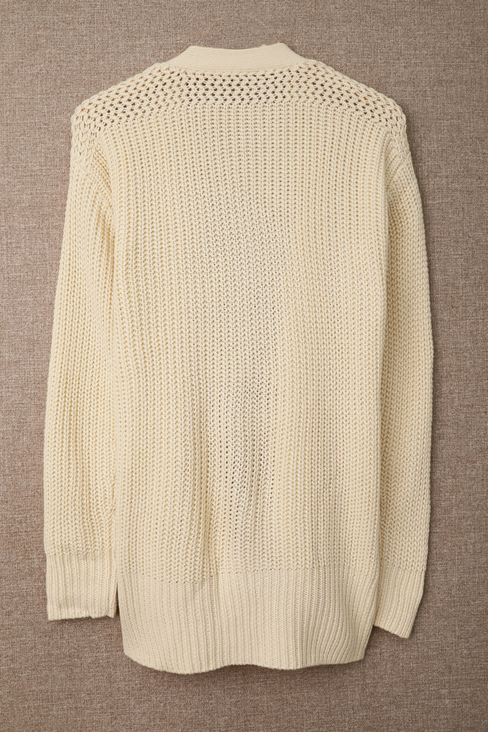 Beige wrap V-neck sweater with side tie from Harlequin Daisy, featuring soft fabric and stylish design for casual wear.