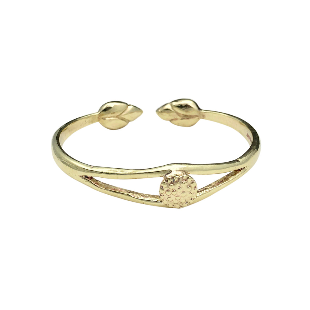 Ariel Bombshell Lotus cuff bracelet featuring intricate jewelry design with lotus motifs, crafted in metal for a bold statement look.