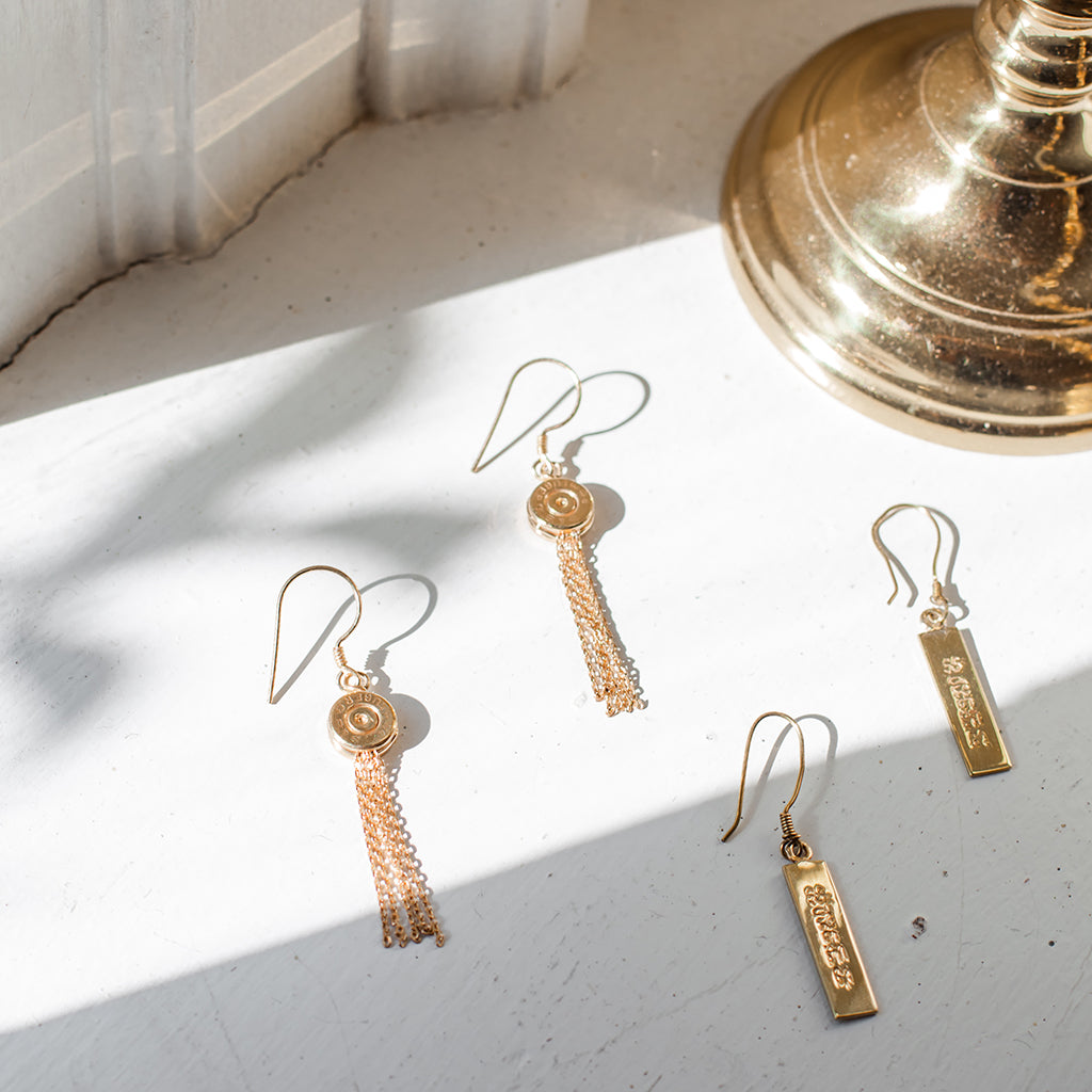 Ariel Bullet Tassel Earrings featuring vibrant tassels and bullet-shaped accents, stylish jewelry for casual or formal wear.