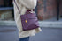 DC-Canopy Verde Atlantic Crossbody Satchel showing adjustable strap, structured design, and front pocket for accessories.