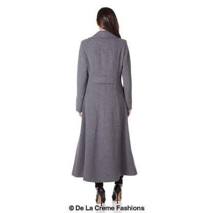Carmelle wool blend double-breasted maxi coat by Rose Eleusis, shown hanging on a rack with a tailored fit and classic design.