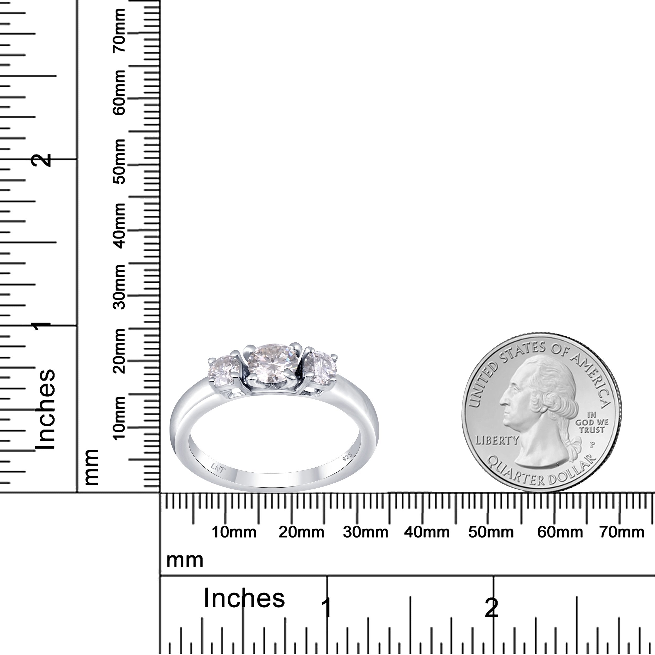 Sterling silver white moissanite 3-stone ring featuring sparkling gemstones and a sleek band, elegant jewelry by Copper Juniper.