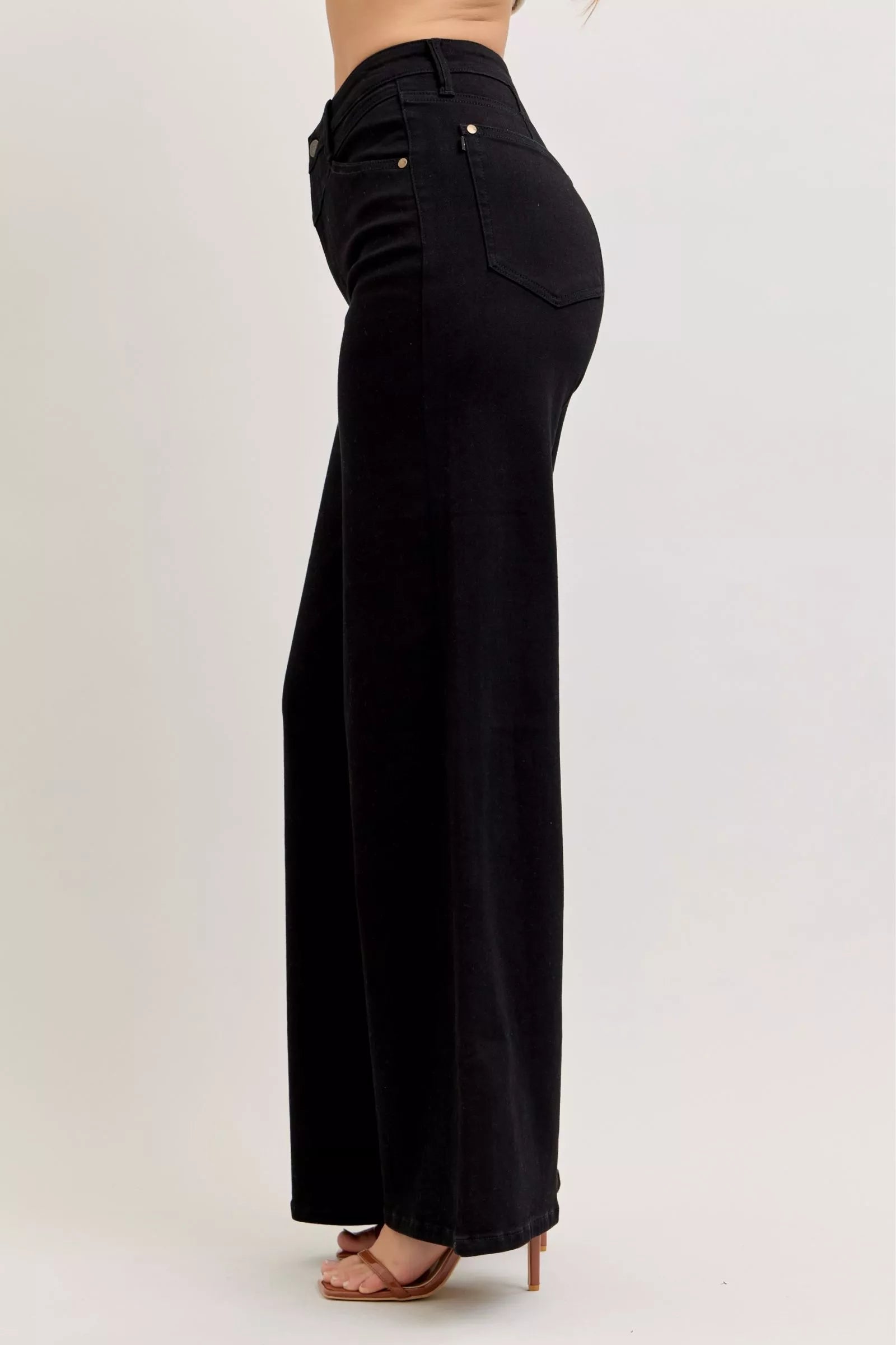 Pair of Judy Blue high-waisted wide-leg jeans with front pockets, displayed on a plain background.