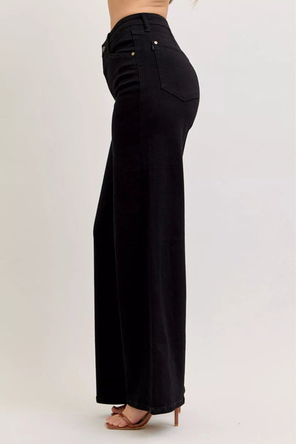 Pair of Judy Blue high-waisted wide-leg jeans with front pockets, displayed on a plain background.