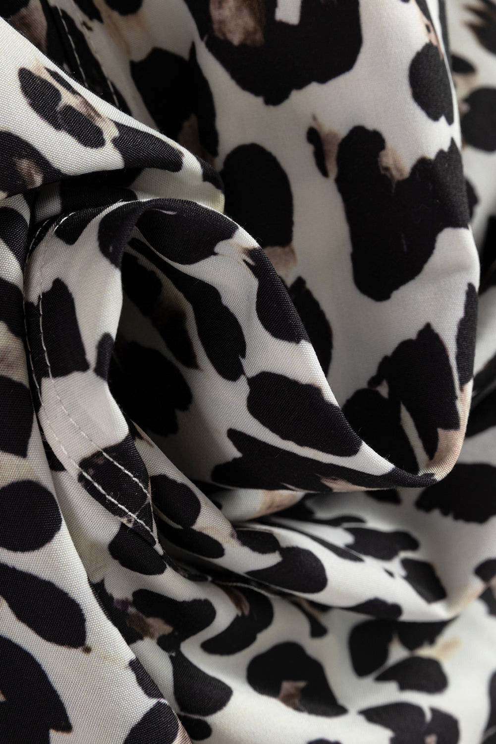 Leopard stripe collared long sleeve flared dress by Byzantium Bay, featuring a stylish pattern and feminine silhouette.