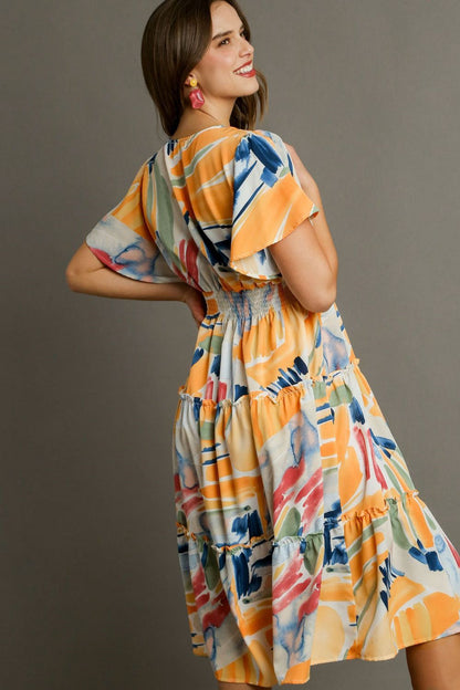Full size abstract print flutter sleeve frill tiered midi dress by Jade Icarus, featuring colorful tiered fabric and flutter sleeves.