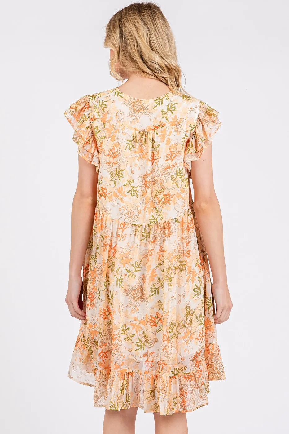 Automotive image featuring a Jade Icarus Mittoshop floral chiffon ruffle short sleeve mini dress.